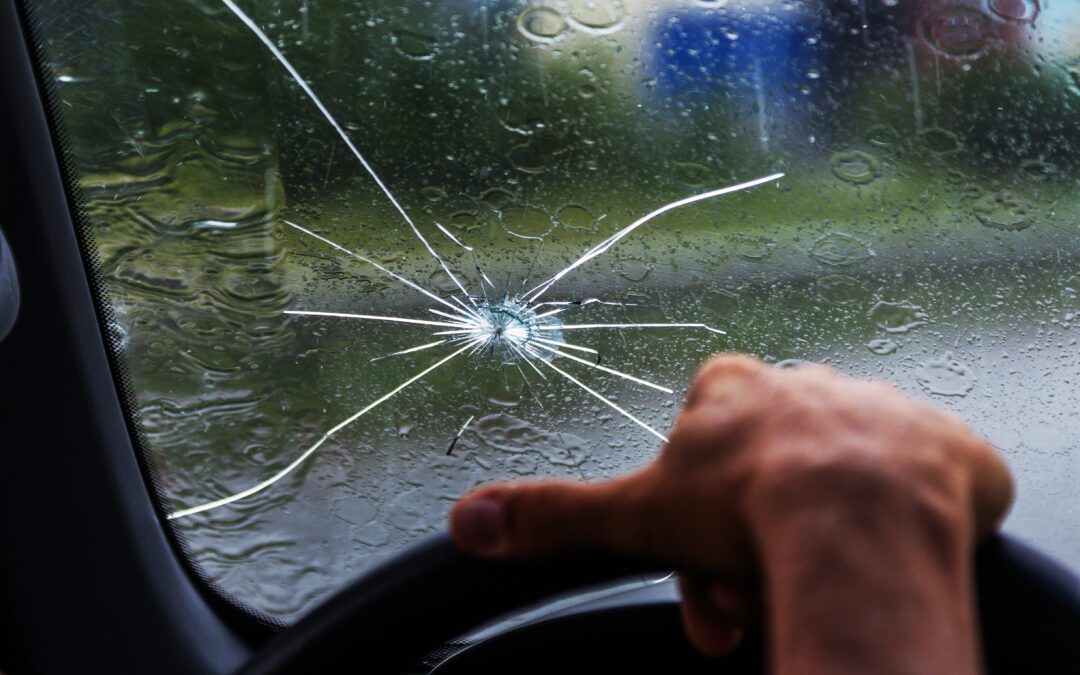 A cracked windshield which needs to be repaired